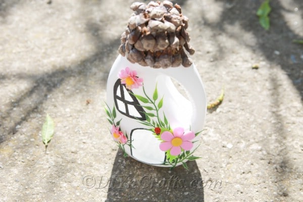 Top view of a fairy house on pavement 