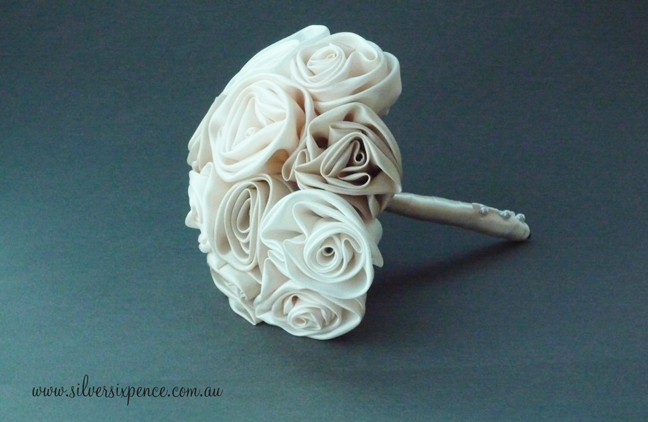 Tan and white bridal bouquet made of handcrafted fabric roses.